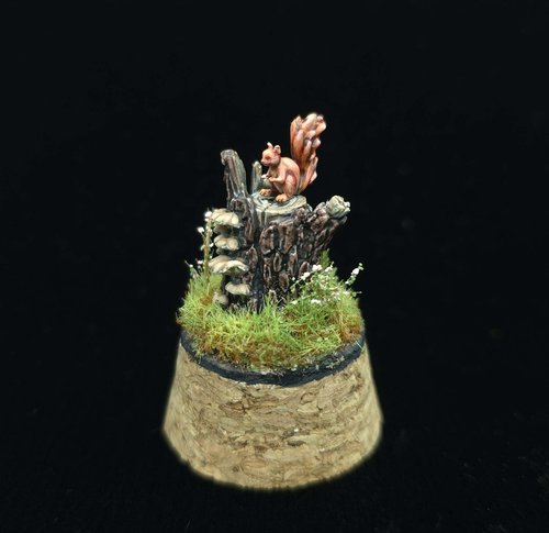 Squirrel sitting on treestump